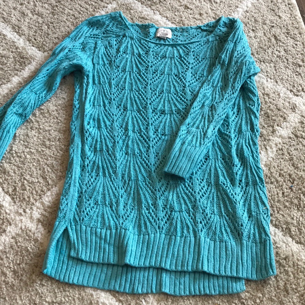 Teal sweater. Goes great with a cami underneath.